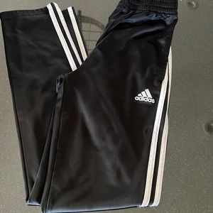 Adidas Big Boys track pant in black 3 white stripes Size L (14-16).